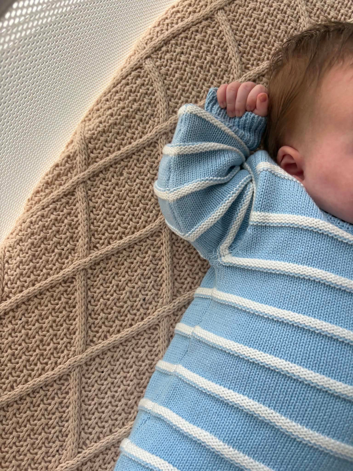 Sky blue organic cotton newborn knit romper with wooden buttons