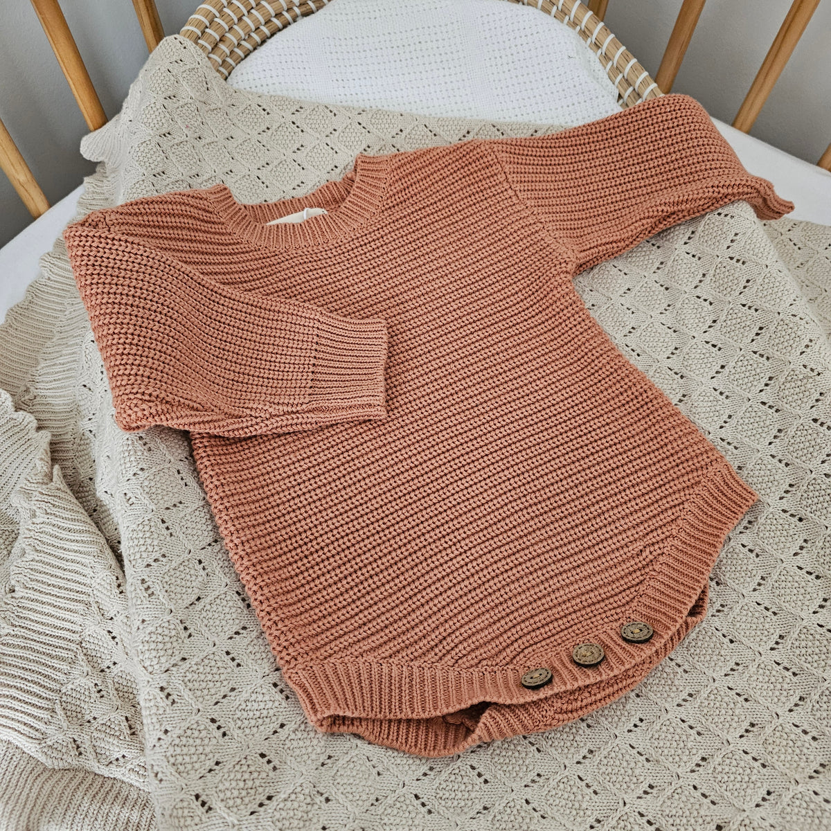 Dusty Clay organic cotton newborn romper, soft knitted baby outfit for 0–3 months by Harper Clare.