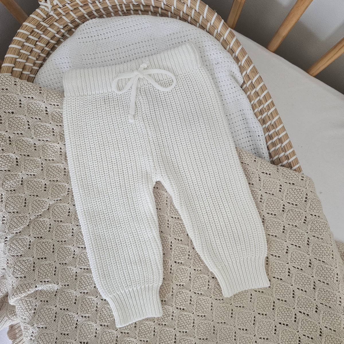 Beige organic cotton soft knitted baby pants for 0–3 months by Harper Clare.