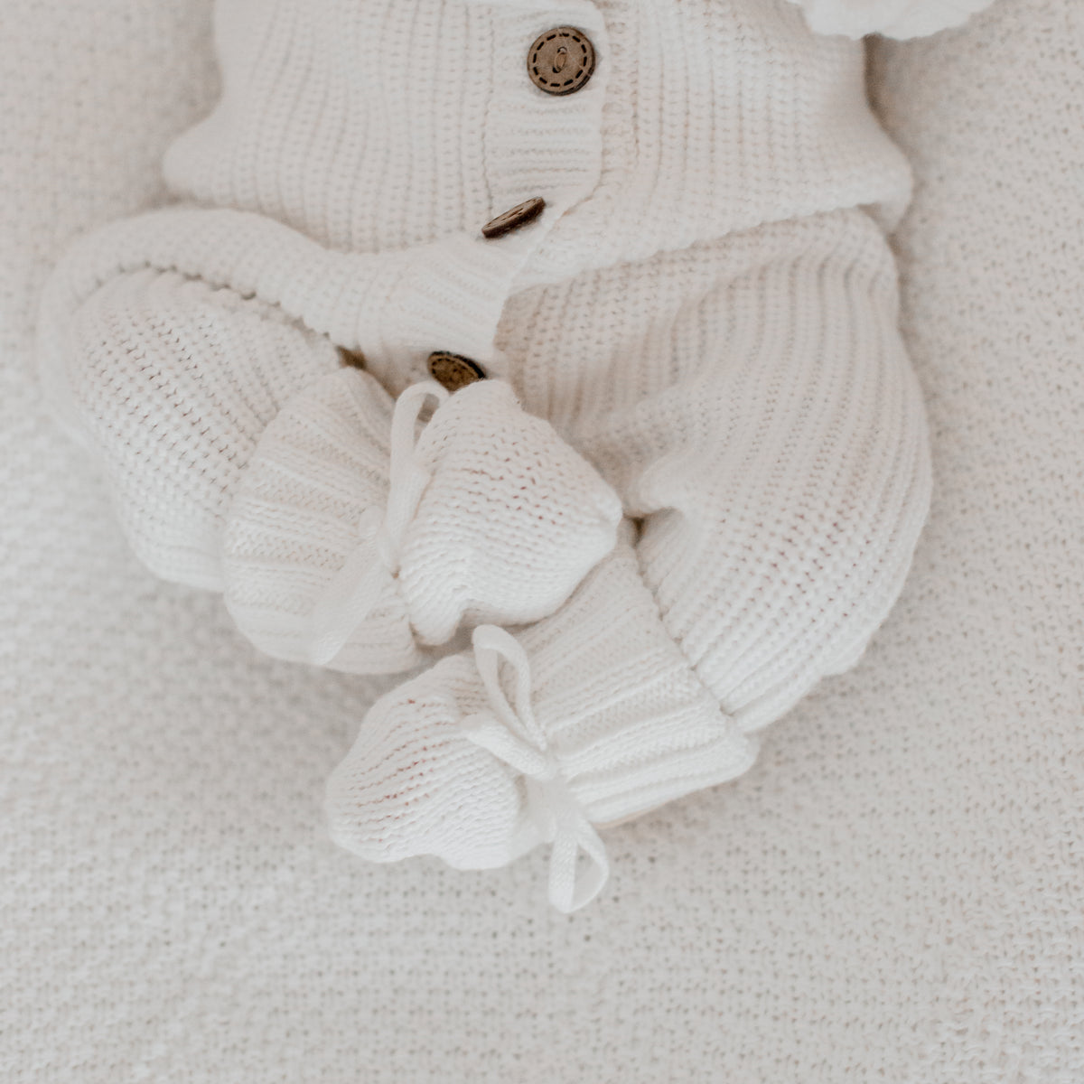 Milk White organic cotton newborn booties, soft knitted baby booties for 0–3 months by Harper Clare.