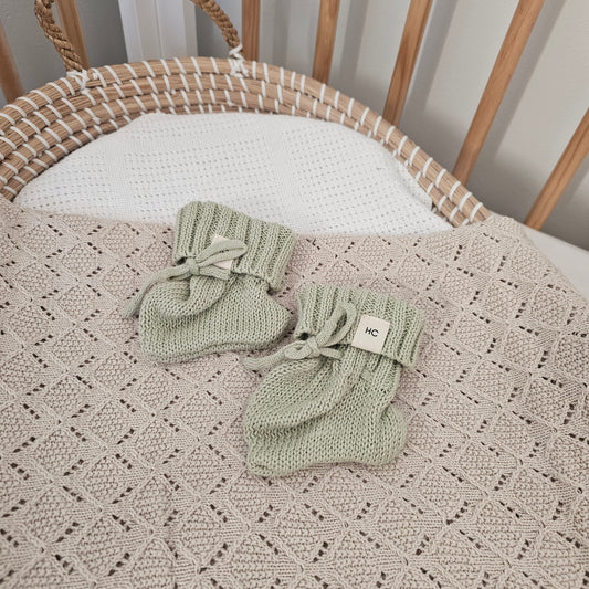 Tea Green organic cotton newborn booties, soft knitted baby booties for 0–3 months by Harper Clare.