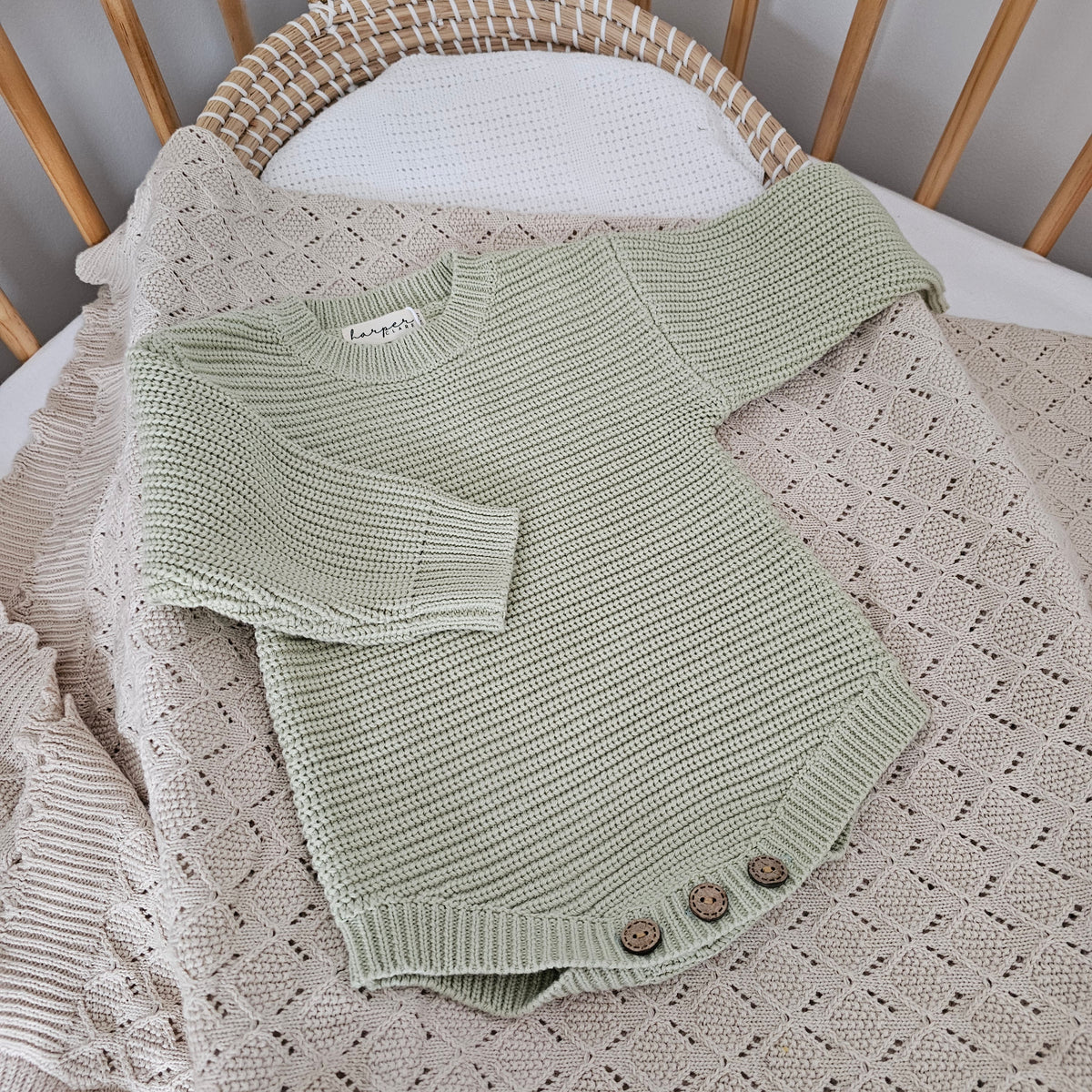 Tea Green organic cotton newborn romper, soft knitted baby outfit for 0–3 months by Harper Clare.