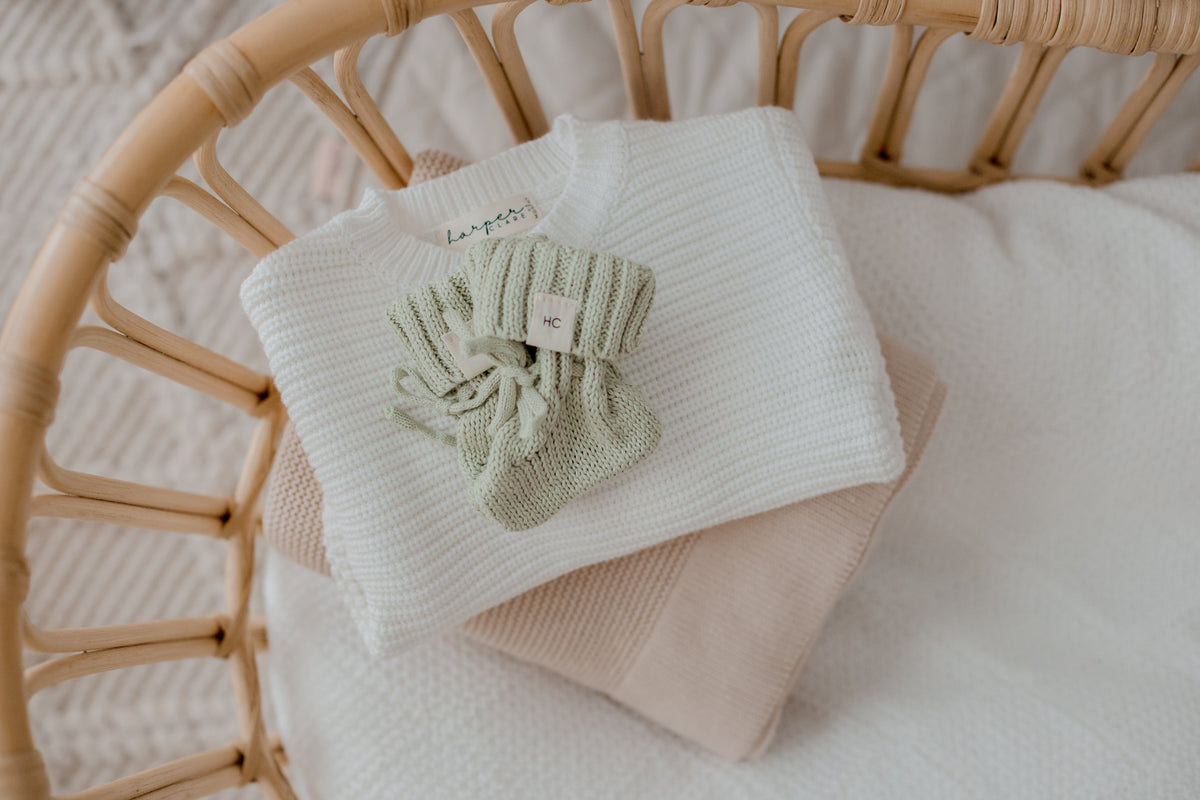 Tea Green organic cotton newborn booties, soft knitted baby booties for 0–3 months by Harper Clare.