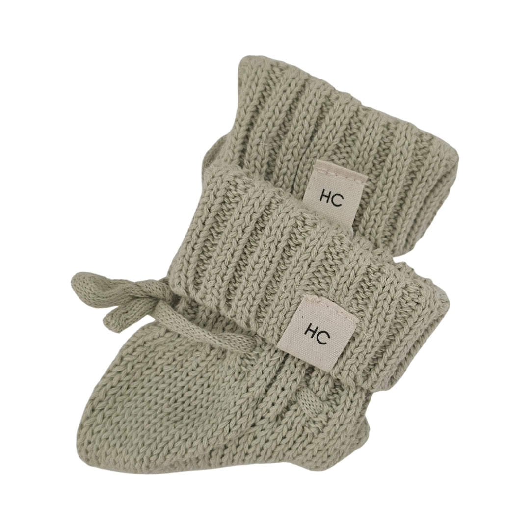Tea Green organic cotton newborn booties, soft knitted baby booties for 0–3 months by Harper Clare.